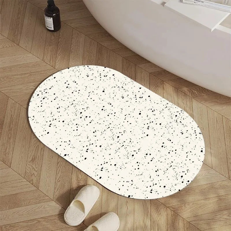 tapis bain ovale moderne pois aléatoires couleurs variées résistant l'eau