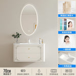 meuble salle bain noir blanc tiroirs vasque ornements dorés classique fixations murales accessoires cosmétiques
