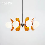 suspension lumineuse moderne sphères translucides métal doré salon chambre salle manger