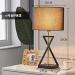 lampe sol moderne abat jour tissé structure géométrique noir doré led minimaliste