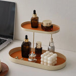 support cosmétiques moderne plateau bijoux flacons parfum crème bougie beige orange noir vert