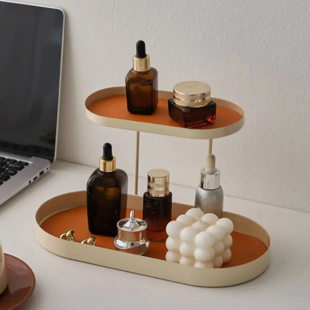 support cosmétiques moderne plateau bijoux flacons parfum crème bougie beige orange noir vert