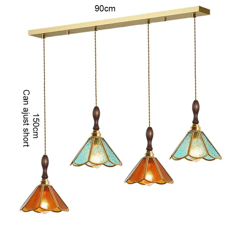 suspension lumineuse verre teinté art deco or marron bleu clair motifs géométriques opacité chaînes