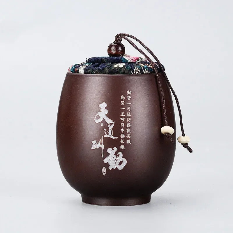 pot thé marron imprimé floral couvercle texte blanc classique traditionnel cordon boule bois épices