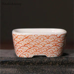 bol traditionnel décoré fruits pommes paysage motifs ondulés blanc orange bleu