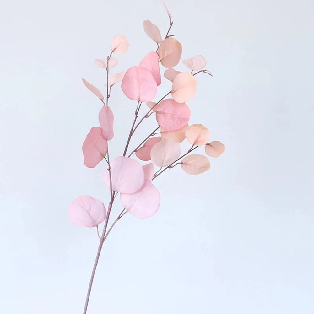 bouquet artificiel feuilles ovales moderne vase transparent support doré couleurs vives exposition intérieure