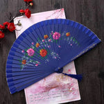éventail pliant bois ajouré double face fleurs colorées ruban pompon rouge rose bleu vert