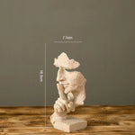 décoration intérieure sculpture résine blanc argent or contemporaine détails sculpturaux base plate maison salon