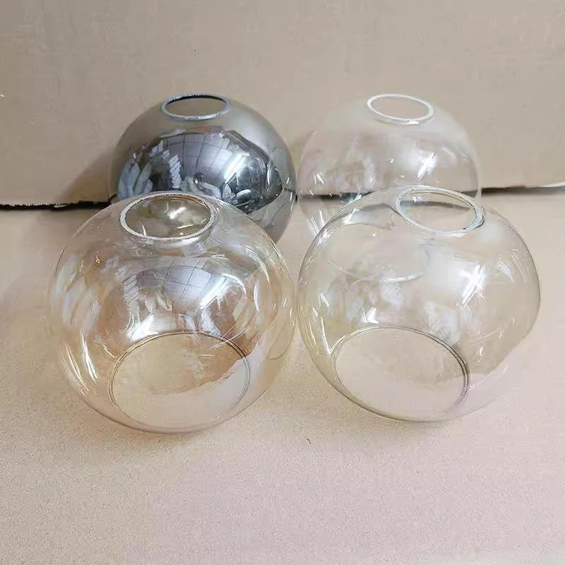 boule verre transparente ambre gris moderne anneau métallique suspension plafonnier lustre minimaliste