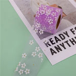 ruban decoratif fleurs blanches violet bleu clair rose vert clair adhésif polyester elasthanne 6cm
