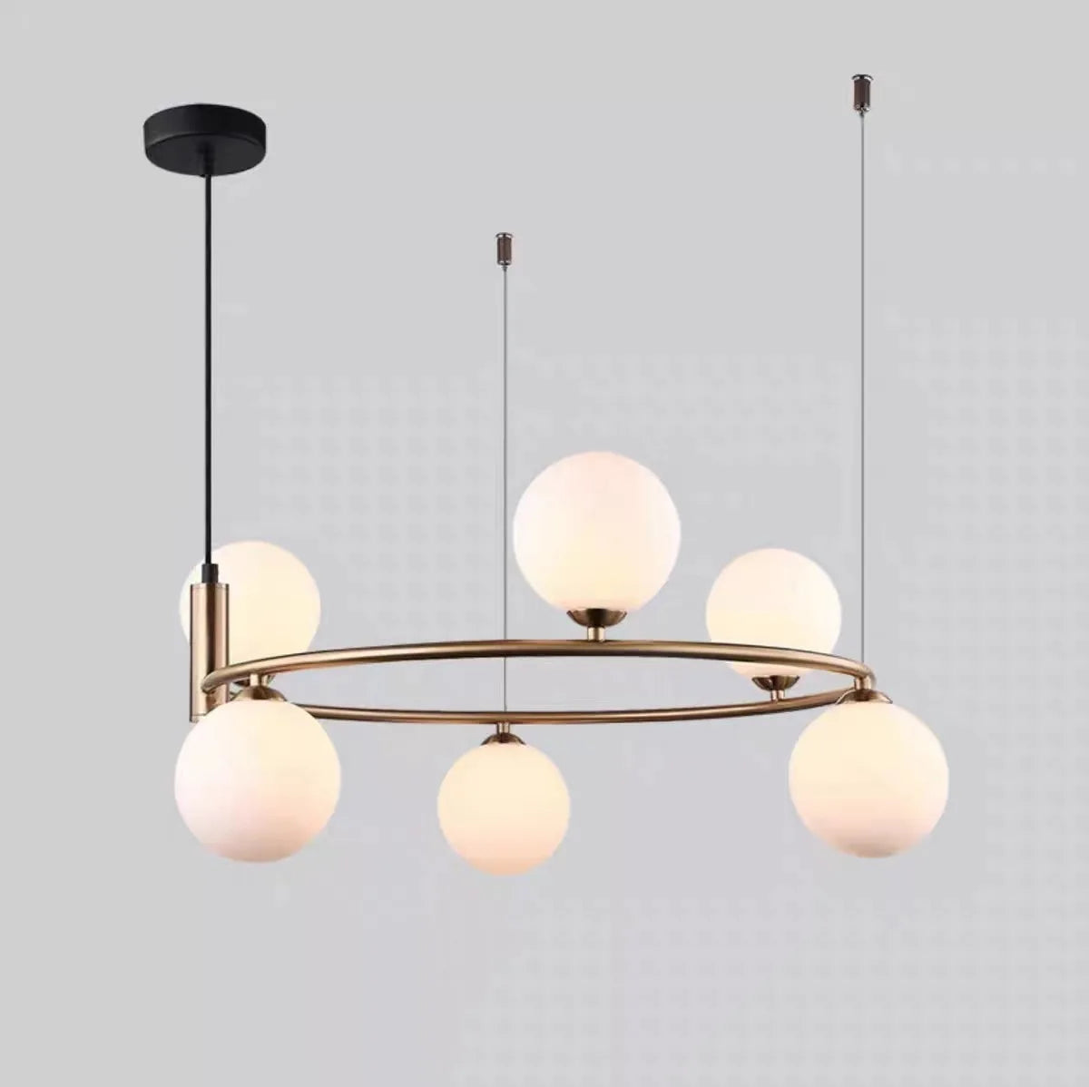 suspension luminaire moderne sphères verre translucides anneau métal doré salon chambre scandinave