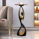 table basse moderne artistique plateau rond noir or blanc