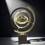sphère artificielle moderne marbrée dorée noire décoration intérieure base carrée geometrique