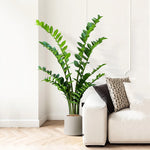 plantes artificielles branches vertes feuilles simples extérieur moderne pot blanc exposé