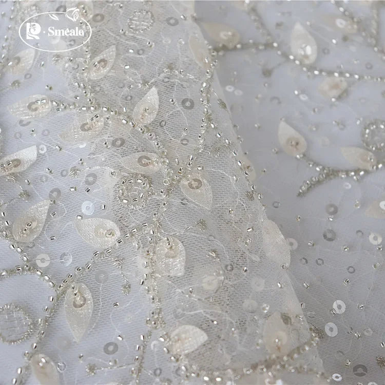 tissu dentelle feuilles brodé élégant polyester translucide blanc argent materiaux couture robes mariage