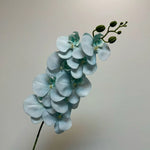 décoration intérieure vase orchidées artificielles fleurs douces feuilles vertes moderne élégant rose blanc violet