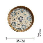 plateau rond rotin coquillages feuilles naturelles décoration boho assiette fruits pain petit déjeuner