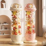 rangement jouets transparent capsule pliable moderne étoiles beige rose figurines poignée