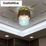lampe moderne or cristal transparent élégante barres dorées inoxydables salon hall