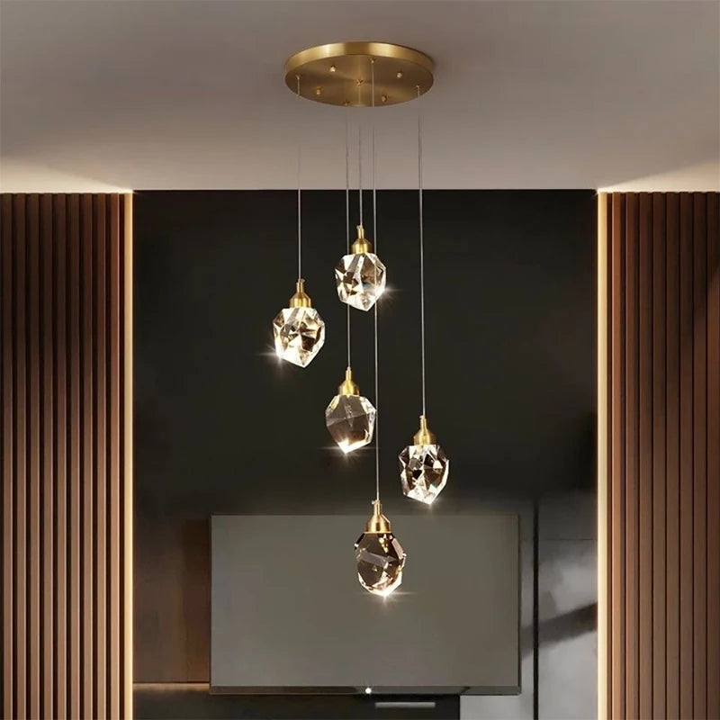 lampe suspendue or transparent cristal facettes géométriques moderne élégante tringles câbles