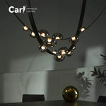 lustre suspension moderne minimaliste noir transparent doré globes organiques chambre salon