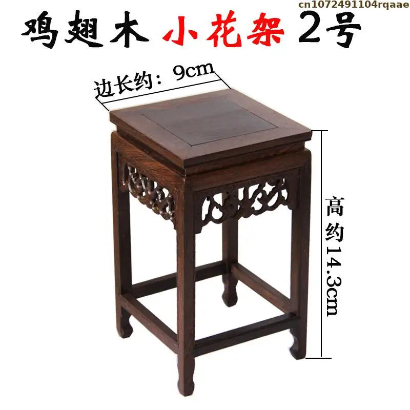 table bois foncée traditionnel gravures décoratives décoration vintage exposant figurines vases bonsaïs