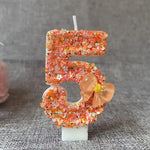 bougie anniversaire chiffre orange paillettes multicolores décoration brillante fleur centroide