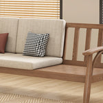 canapé places scandinave beige clair fauteuil pied poule moderne tapis géométrique terracotta blanc