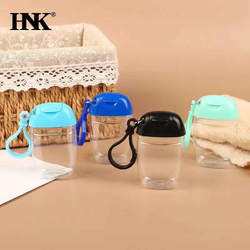 bouteilles rechargeables transparentes modernes couleurs variées anneaux boucles pratique mini désinfectant main cosmétique alcool