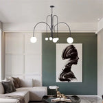 lustre moderne rouge noir doré sphères blanches opaques suspension salon chambre