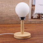 lampe table moderne minimaliste blanc base bois abat jour sphérique mat intérieur