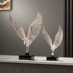 statuette animale moderne transparente dorée oiseau cerfs ailes déployées base noire