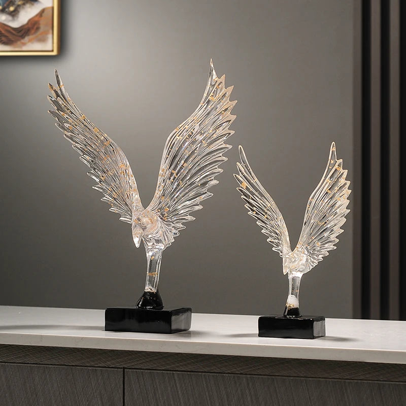 statuette animale moderne transparente dorée oiseau cerfs ailes déployées base noire