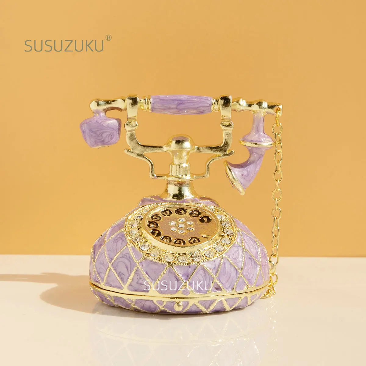 boîte bijoux téléphone vintage cuir géométrique violet vert clair élégant rétro chaîne dorée porte