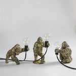 lampe poser moderne or noir ampoule led texture gorille animalier tringle câble noir