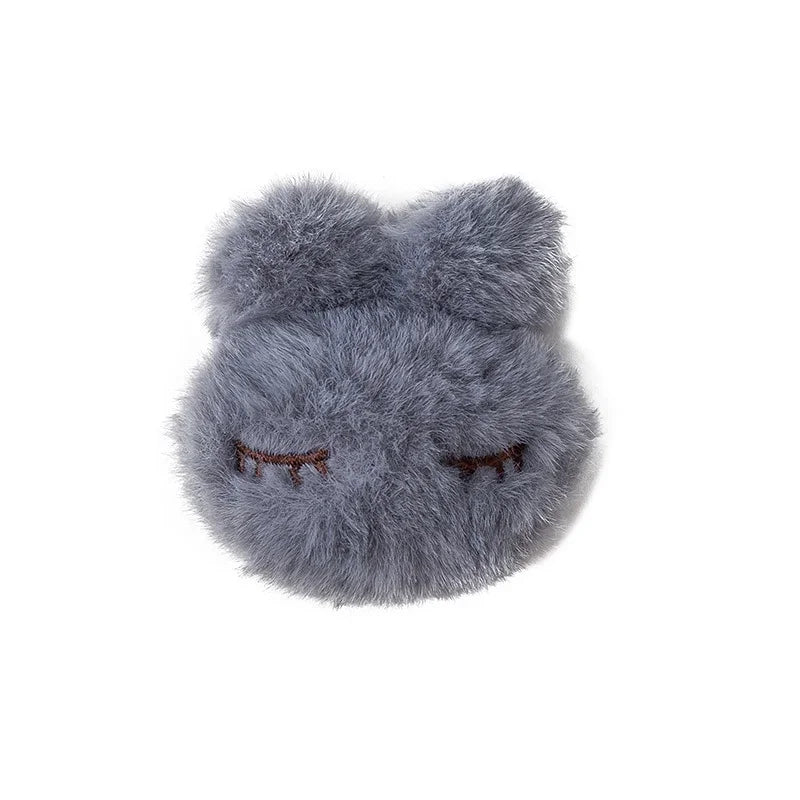 porte plaid peluche rose clair gris yeux fermés doux anti dérapant fixateur couette