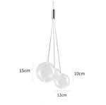 suspension lumineuse moderne sphères brillantes or argent transparentes chambre salle manger