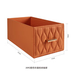 boîte rangement cuir matelassé poignées métalliques chambre moderne