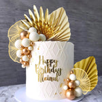 décoration gâteau moderne feuilles dorées boules blanches dorées numéros brillants mariage anniversaire fête