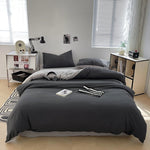 Housse de couette microfibre brossée gris foncé sur lit 200x220 cm