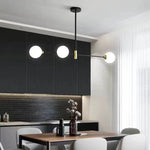 suspension lumineuse moderne minimaliste noir doré blanc sphères translucides métal poli