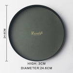 présentoir rond moderne plateau uni vert foncé orange noir maquillage soins parfums cosmétiques table