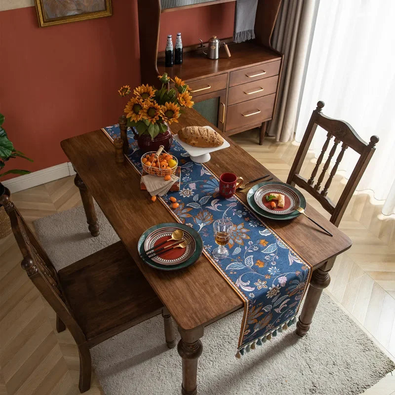 nappe bohème motifs floraux franges couleur bleu foncé orange verte marron rustique