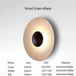 applique murale contemporaine dorée noire led fixée mur ronde lisse