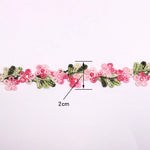 ruban decoratif brode fleurs motifs floraux couleur rouge rose vert blanc jaune solvable eau