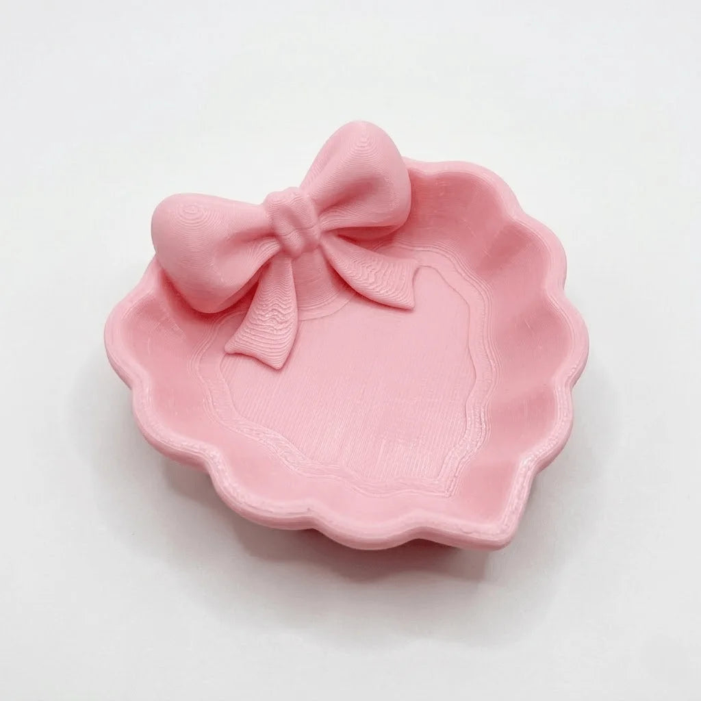 plateau bijoux forme cœur motif nœud rose texture légèrement rugueuse décoration féminine rangement bijoux