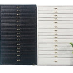 coffret bijoux moderne simili cuir noir blanc vert compartiments poignées dorées stockage sécurité