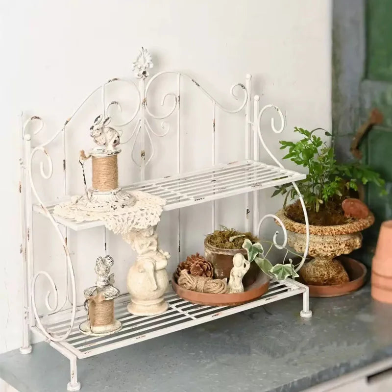 étagère vintage deux niveaux fer forgé motifs floraux pots plantes céramique fleurs vases bougiesextérieurintérieur