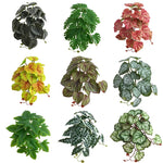 plantes artificielles feuilles vertes rouges noires modernes décoration extérieure mariage centro commercial exposées