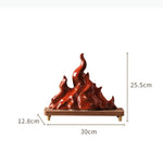 sculpture moderne flamme rouge brillante effet métallique pied bois doré